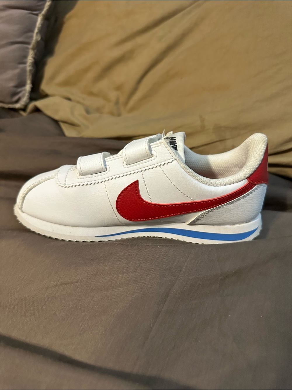 Nike Kids White Sneaker with Red Swoosh